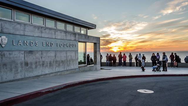 The outside of Lands End Lookout at sunset