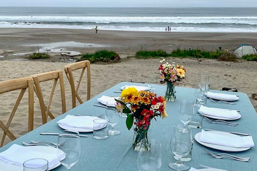 A fancy dining table is set on Stinson Beach.