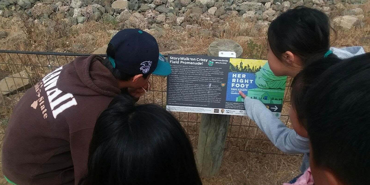 children looking at a storyboard and pointing