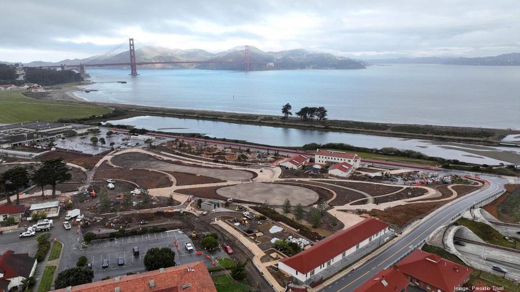 In progress shot of the Presidio Tunnel Tops with the Golden Gate Bridge visible in the background.