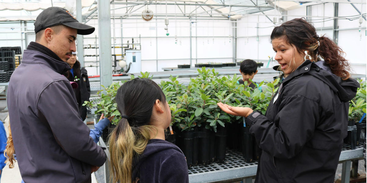 A Nurseries Education Intern engages with youth during a summer camp program