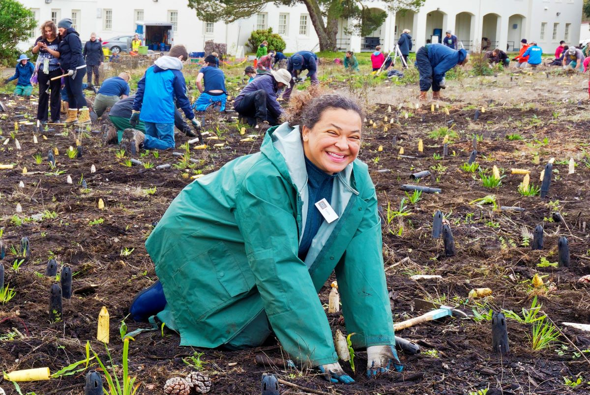 A participant gives a big smile during Presidio Planting Day