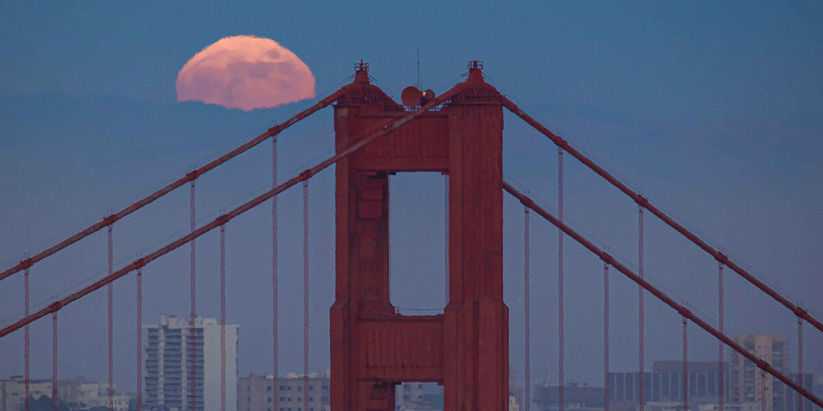 Full moon rising over Golden Gate Bridge