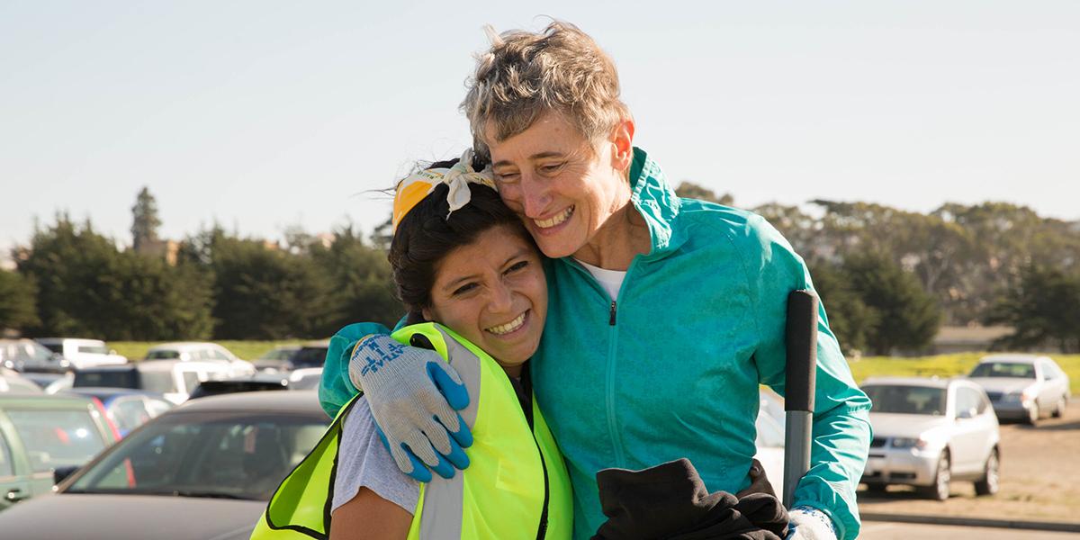 Secretary of the Interior Sally Jewell shares a joyful moment with Park Stewardship restoration intern Marcela Maldonado.