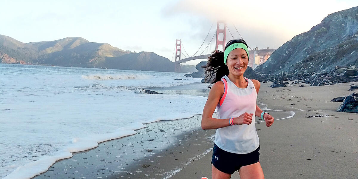 YiOu Wang running at Baker Beach