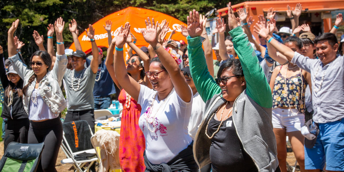 People raising hands in the air