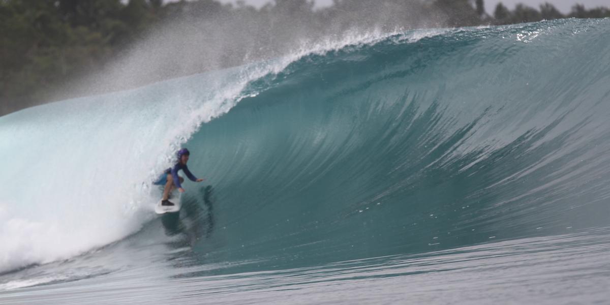 Penny Tibbetts surfing