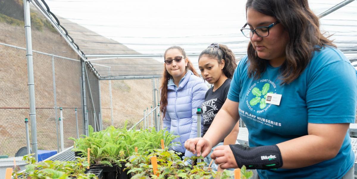 Students check on plants at the Oceana High School Nursery