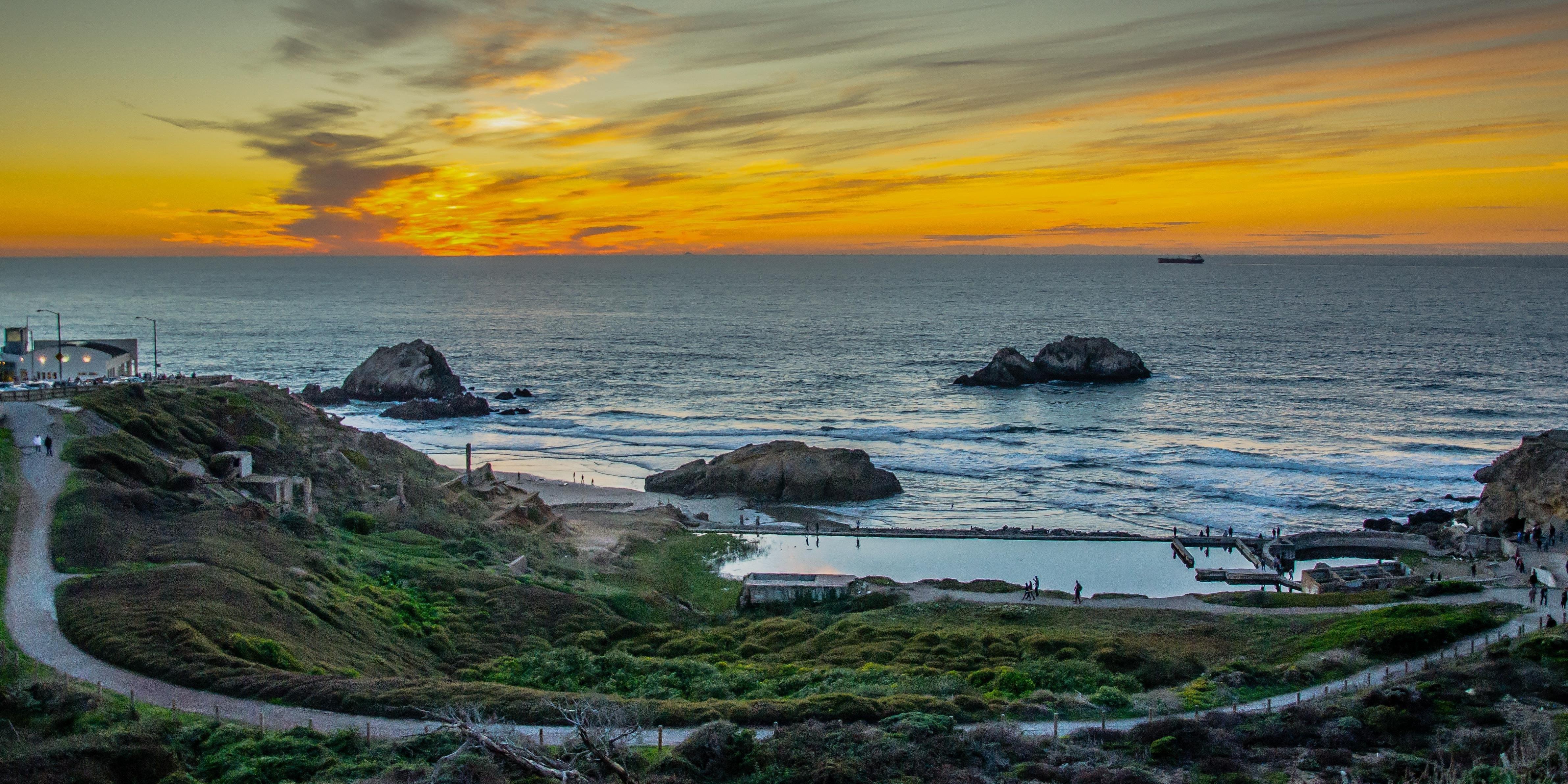 Colors of sunset wash over Sutro Baths