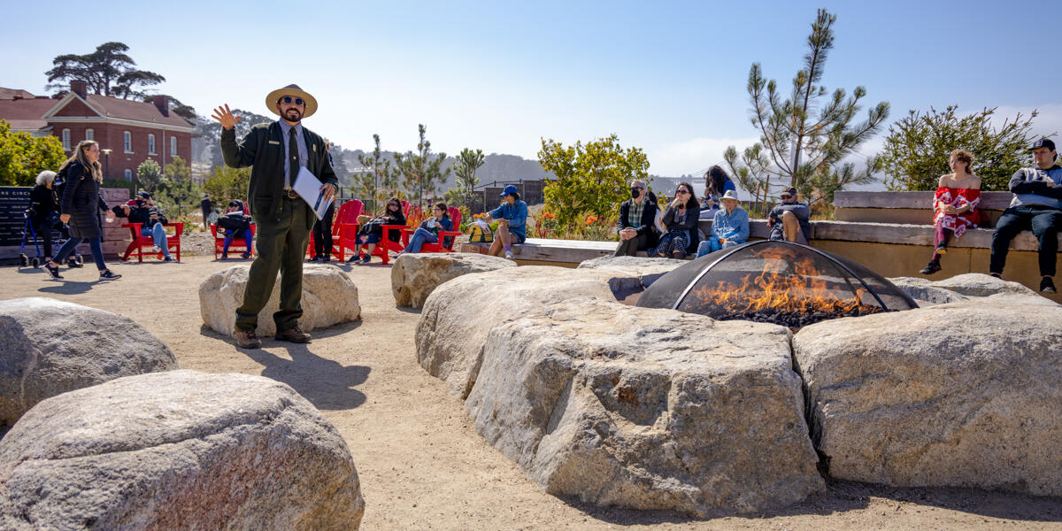 Ranger Talks at the Presidio Campfire Circle NPS Park Ranger gives a presentation to visitors at the Presidio Campfire Circle