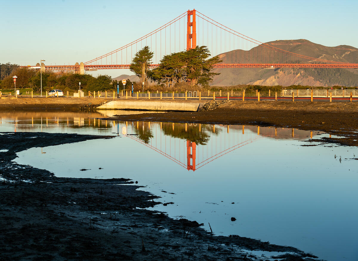 Golden Gate Bridge reflecting in Quartermaster Reach saltwater marsh