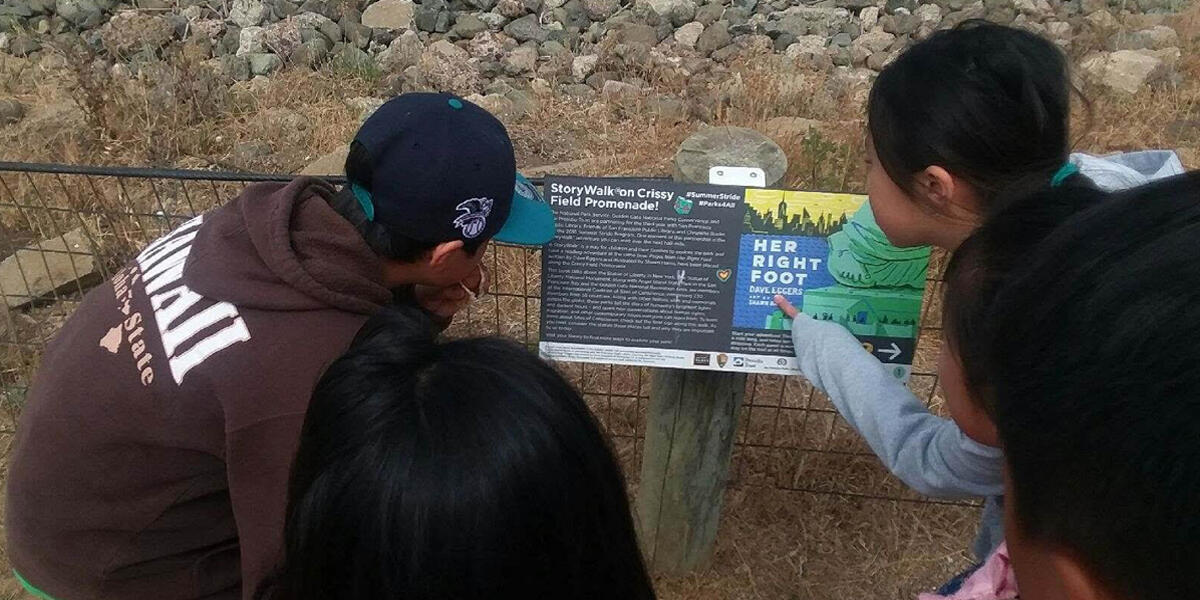 children looking at a storyboard and pointing