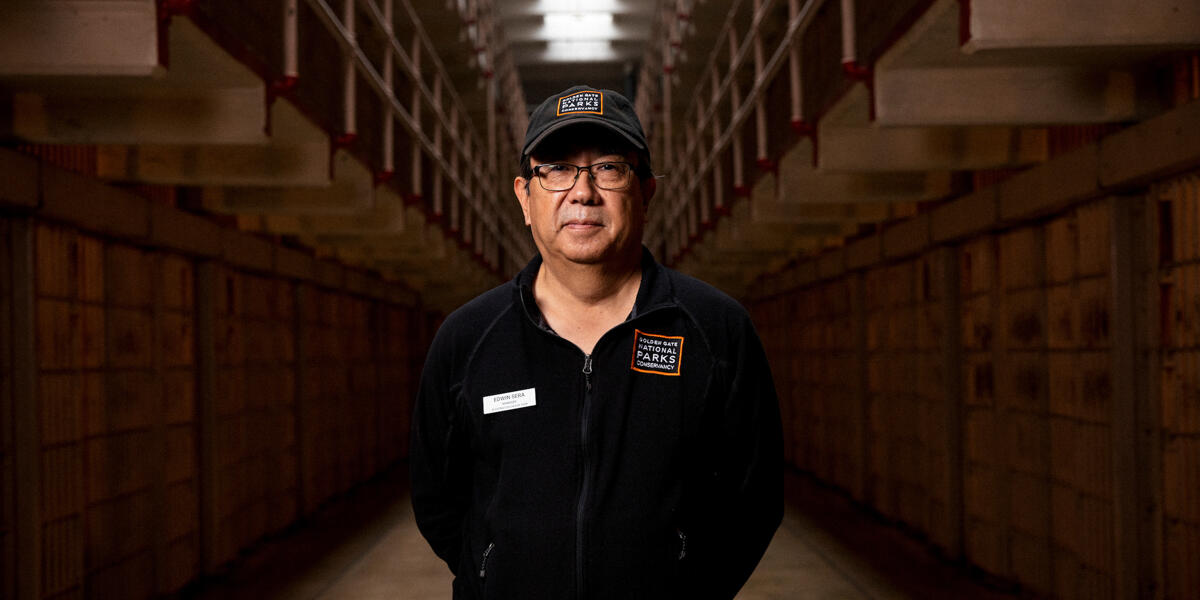 Alcatraz staff member Edwin Sera stands in the Alcatraz Cellhouse.