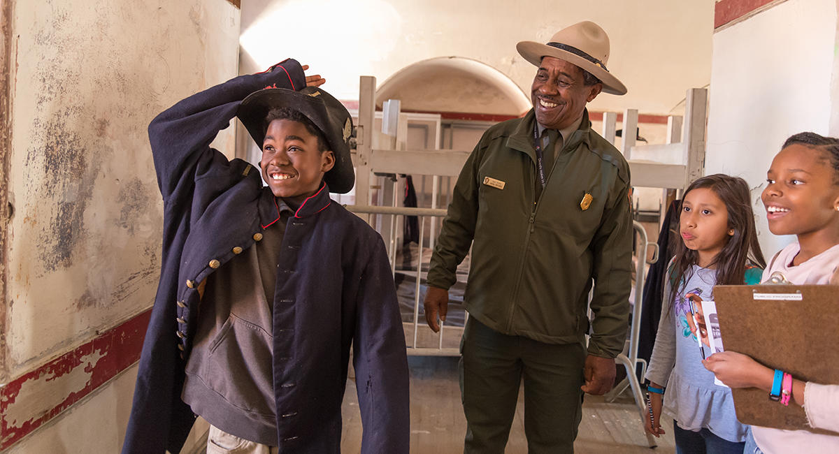 Ranger Rik Penn leads a program with youth at Fort Point in March 2018.