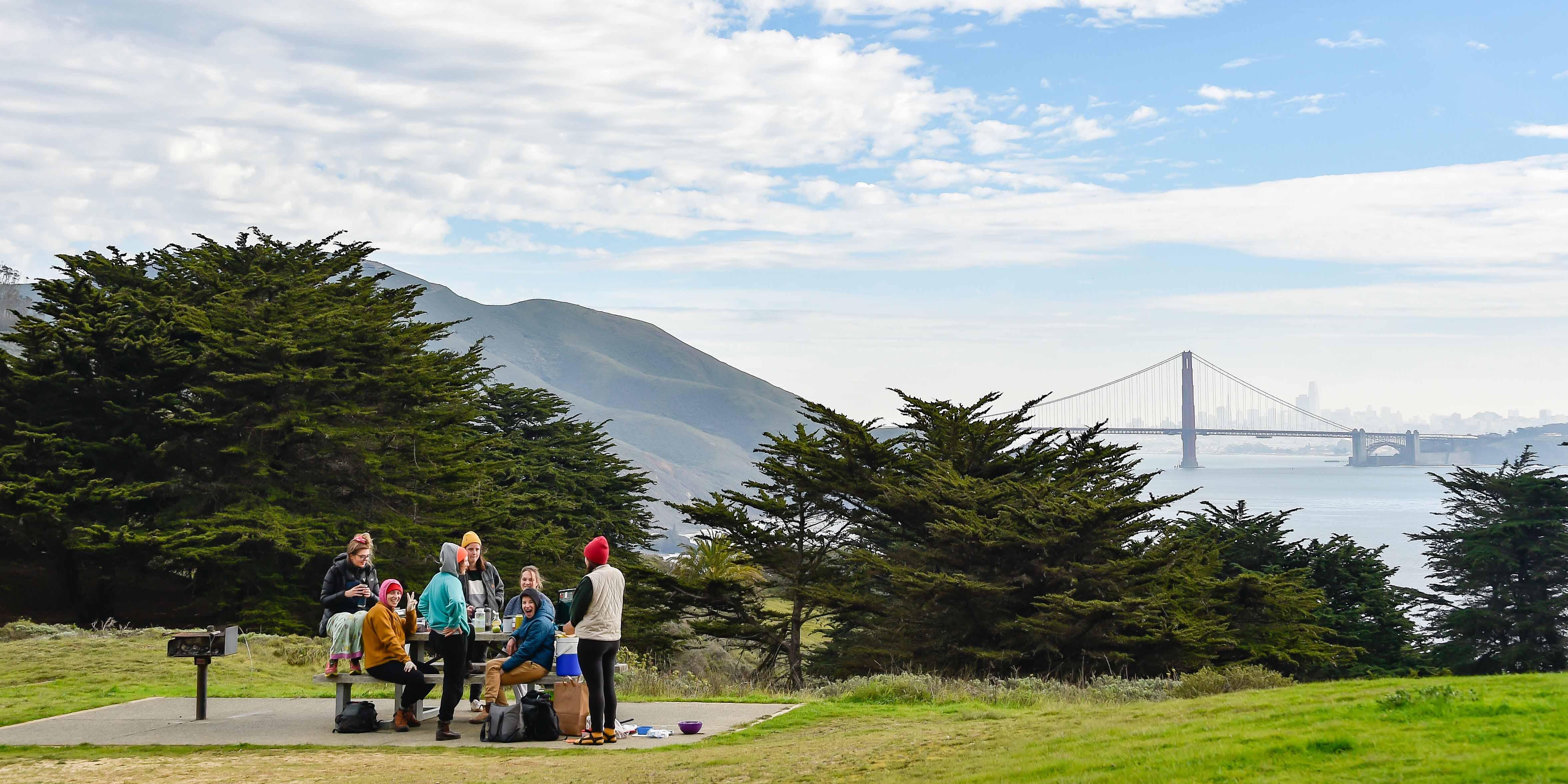People picnic at Battery Wallace in Marin with Golden Gate Bridge views People picnic at Battery Wallace in Marin with Golden Gate Bridge views