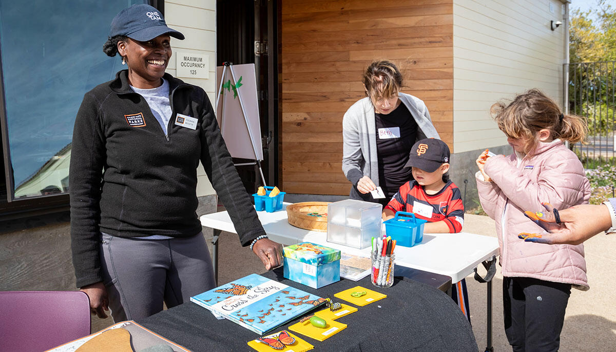 Yolanda Molette connects with participants at a workshop featuring butterfly migration.