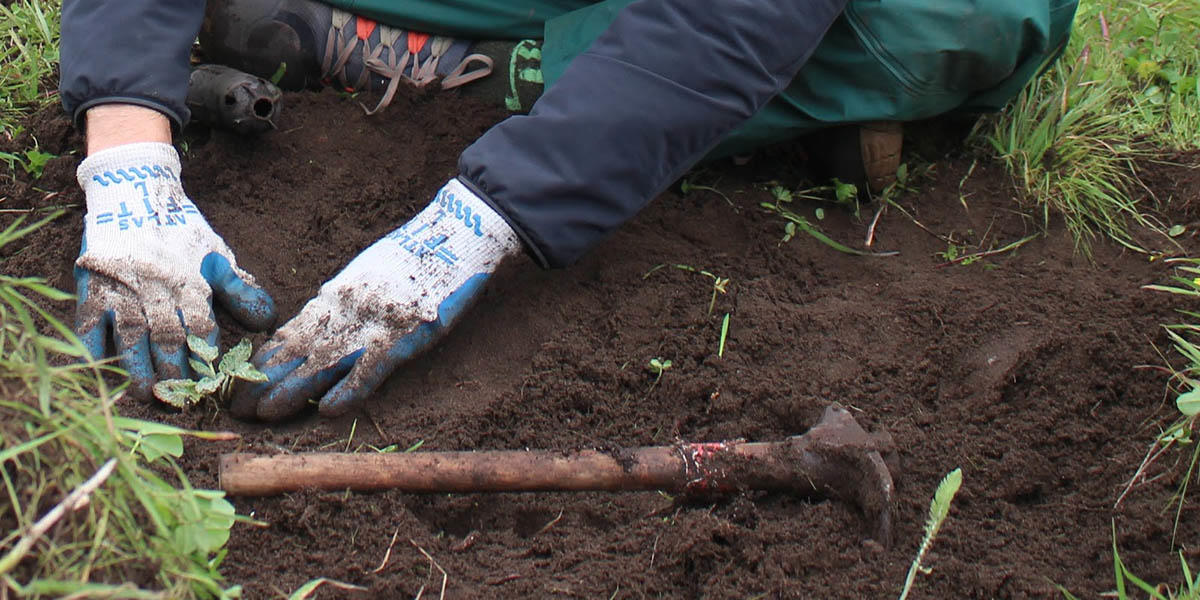 Volunteer working with soil in the Golden Gate National Parks.