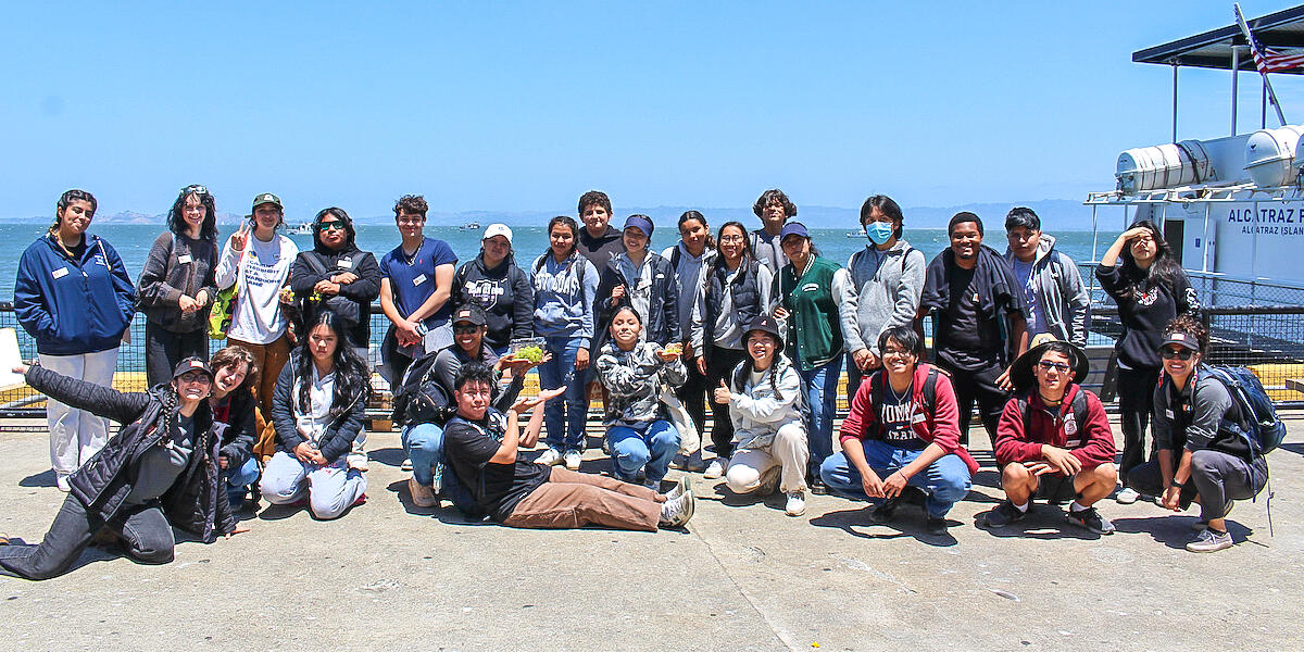 A group of Crissy Field Center youth leadership program members at the docks of Alcatraz Island.