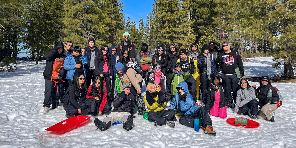 2022-2023 IYEL Winter Trip Crissy Field Center IYEL youth participants pose for a group photo in the snow during their winter trip.