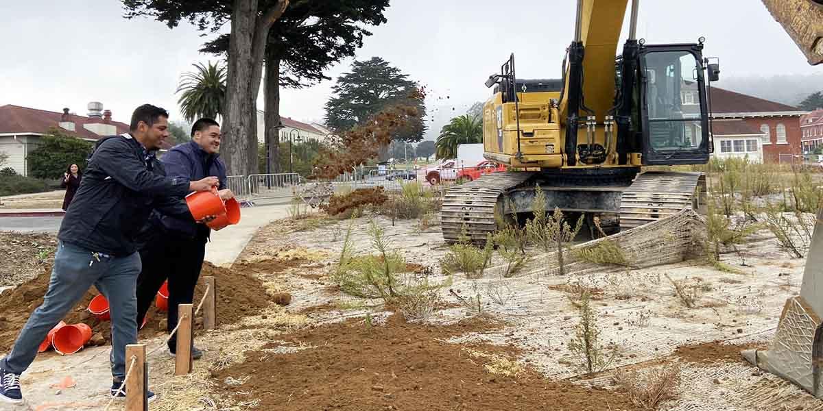 Tossing dirt during the Tunnel Tops "Groundmaking" event.