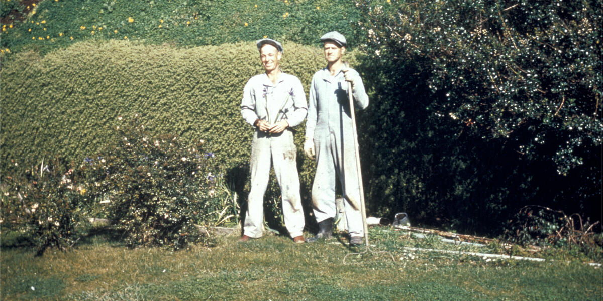 Two Alcatraz inmates standing in the garden