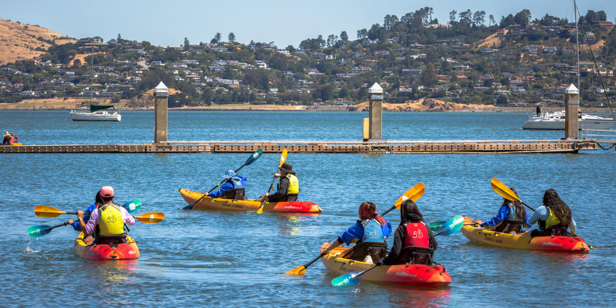 Kayaking youths paddle out from the harbor in Sausalito as part of the Urban Trailblazers program