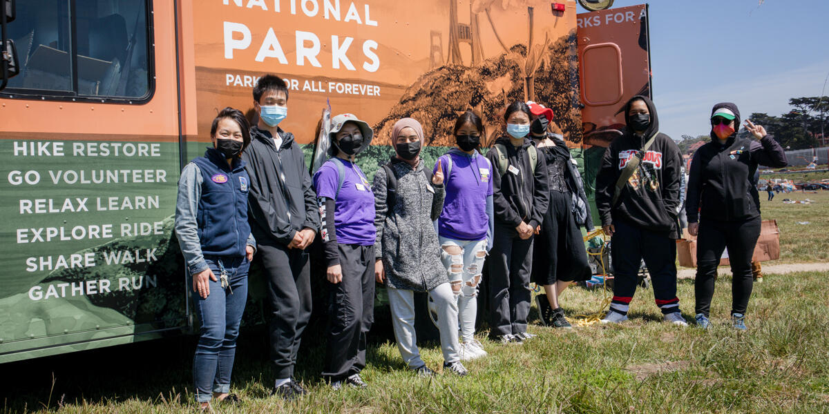 IYEL youth pose for a group photo by the Roving Ranger at Crissy Field.