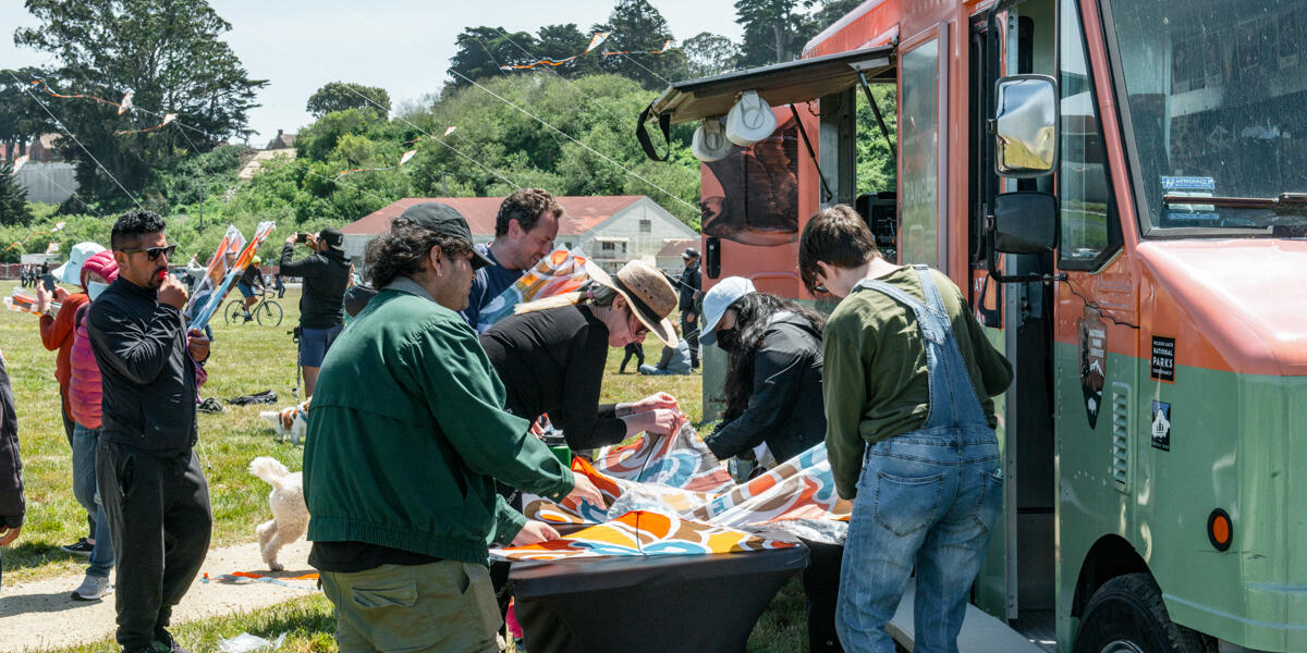 Park goers build their kites by the Roving Ranger at Crissy Field