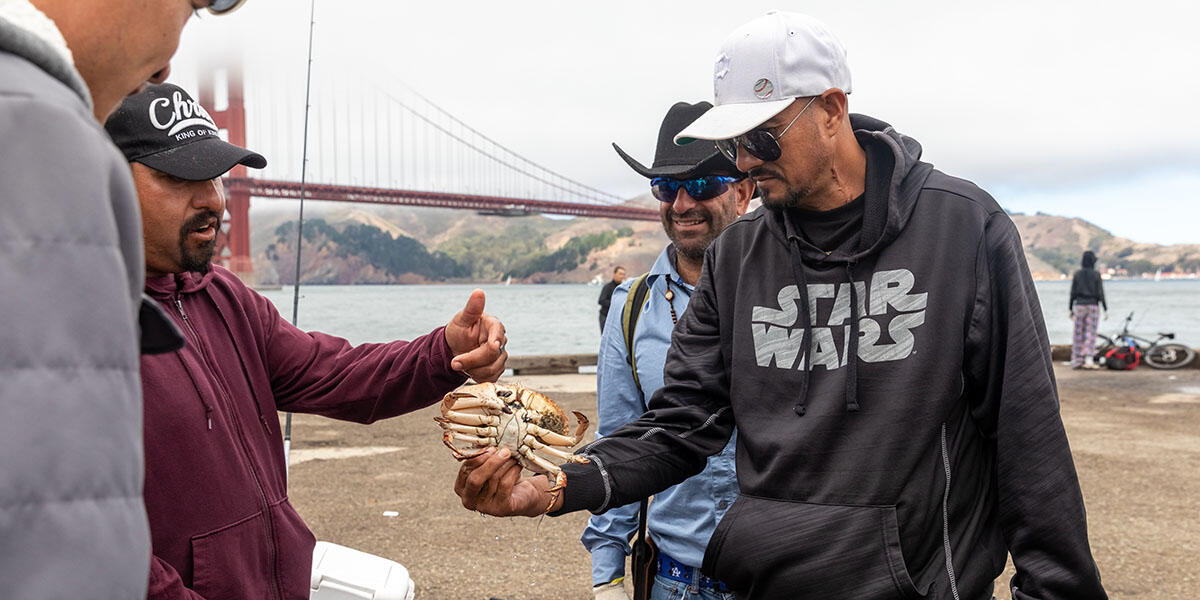 Participants from ALAS (Ayundando Latinos A Soñar) enjoying the "Raíces en la Bahía/Rooted in the Bay" event for farmworkers and their families in September 2024. Activities included crabbing, hiking, and beachside recreation.