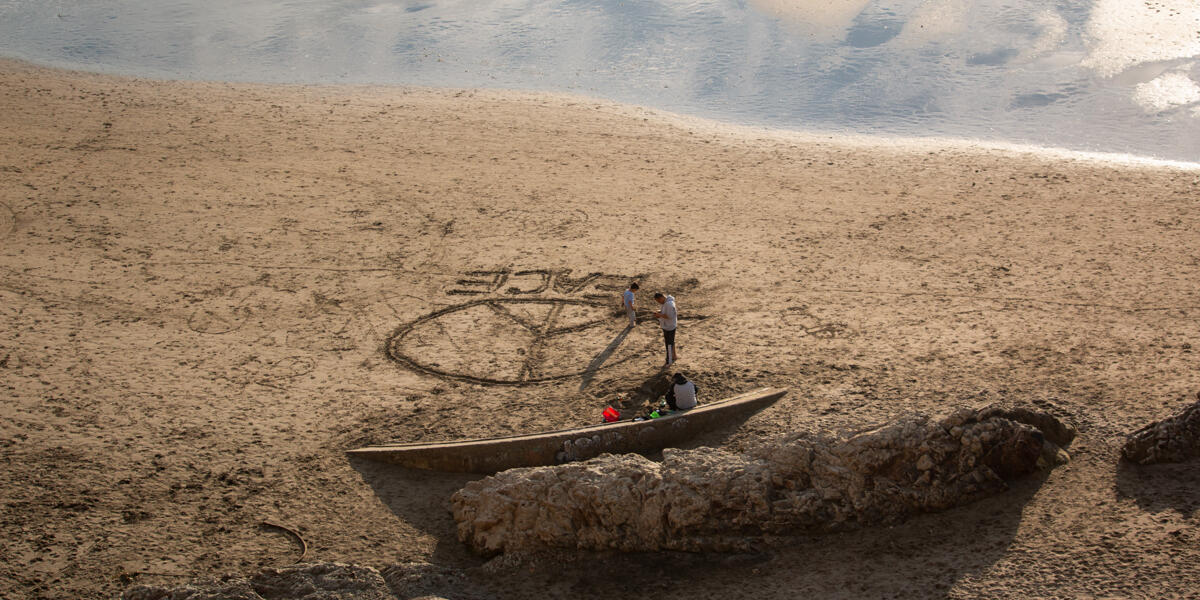 Beach goers create some art in the sand at Fort Funston.