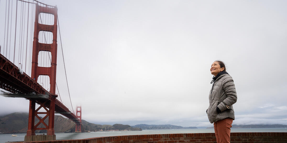 Secretary of the Interior Deb Haaland gazing at the Golden Gate Bridge