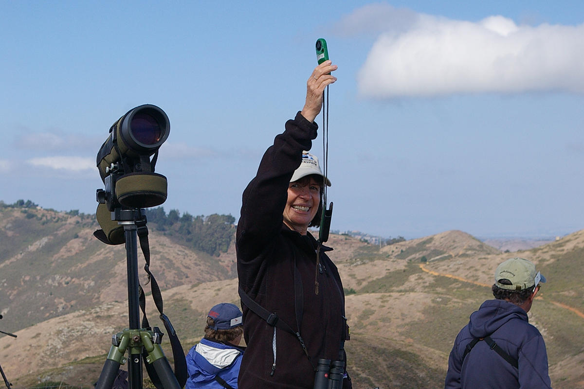 Hawkwatcher Caryl Carr measures the wind