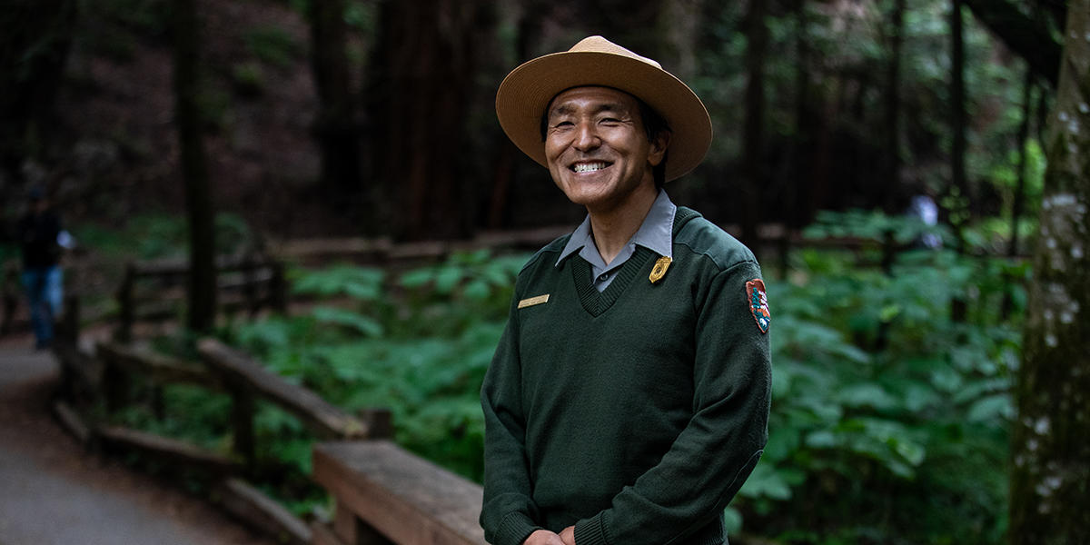 National Park Service ranger smiles in Muir Woods