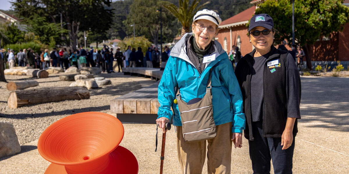 Golden Gate National Recreation Area hero Amy Meyer walks with Conservancy director Audrey Yee at the new Presidio Tunnel Tops.