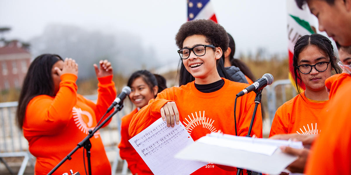 High School students sing in youth choir at Presidio Tunnel Tops ground-making ceremony.