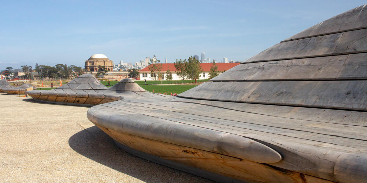 A view of The Palace of Fine Arts and San Francisco skyline from the park bench at the Presidio Tunnel Tops.