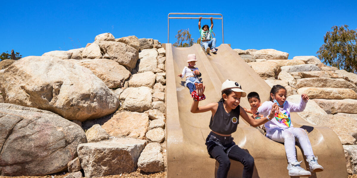 Kids at play having fun on the slide at the Presidio Tunnel Tops Outpost