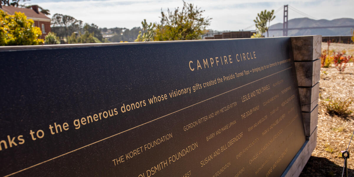 A commemorative plaque at the Tunnel Tops Campfire Circle honors the donors who made the park possible.