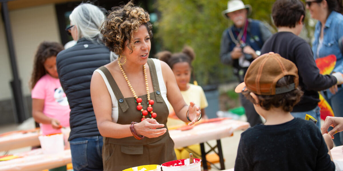 Presidio Activators Council Favianna Rodriguez guides children in art projects.