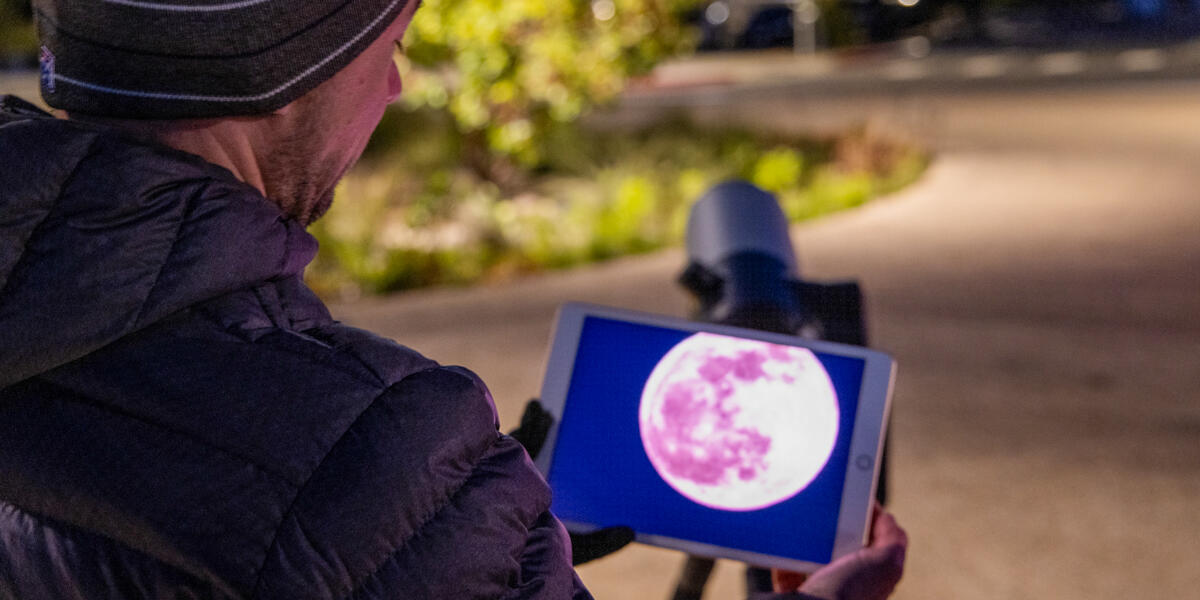 Viewing the pink full moon through an ipad, seen through a Unistellar telescope.