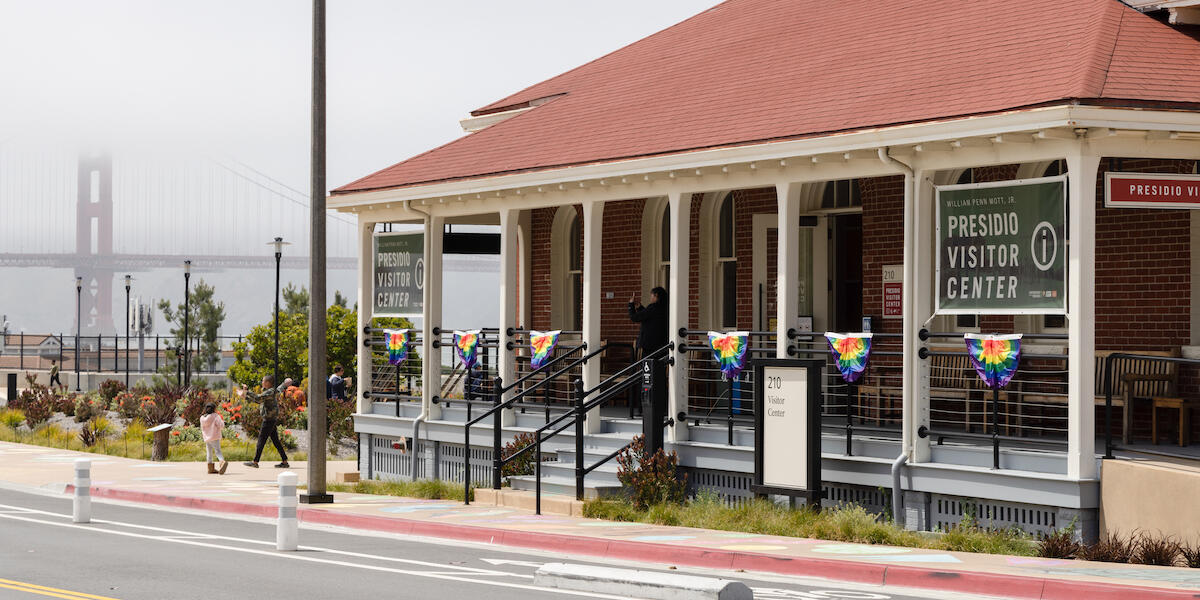 Presidio Visitor Center with rainbow-colored bunting flags for LGBTQ pride. 