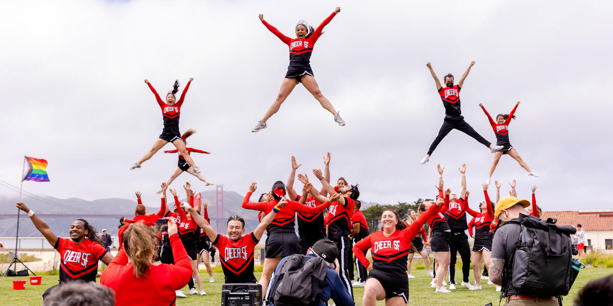 Cheer SF group performers launch into the air at the Presidio Tunnel Tops