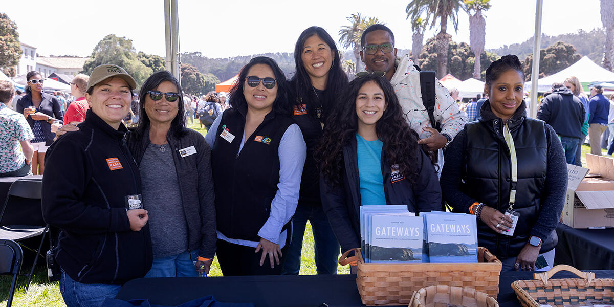 A group of Parks Conservancy staff pose for a photo at Parks4All: Brewfest, a beer festival and fundraiser, on Saturday, July 29th, 2023 in the Presidio of San Francisco.