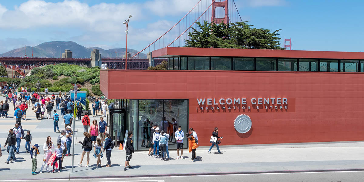 Crowds of people outside the Welcome Center on a beautiful, sunny day