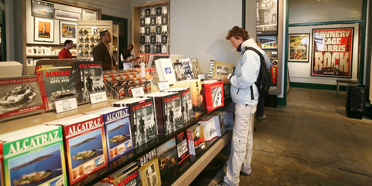 Customer looking at a Capone book in an Alcatraz Island store