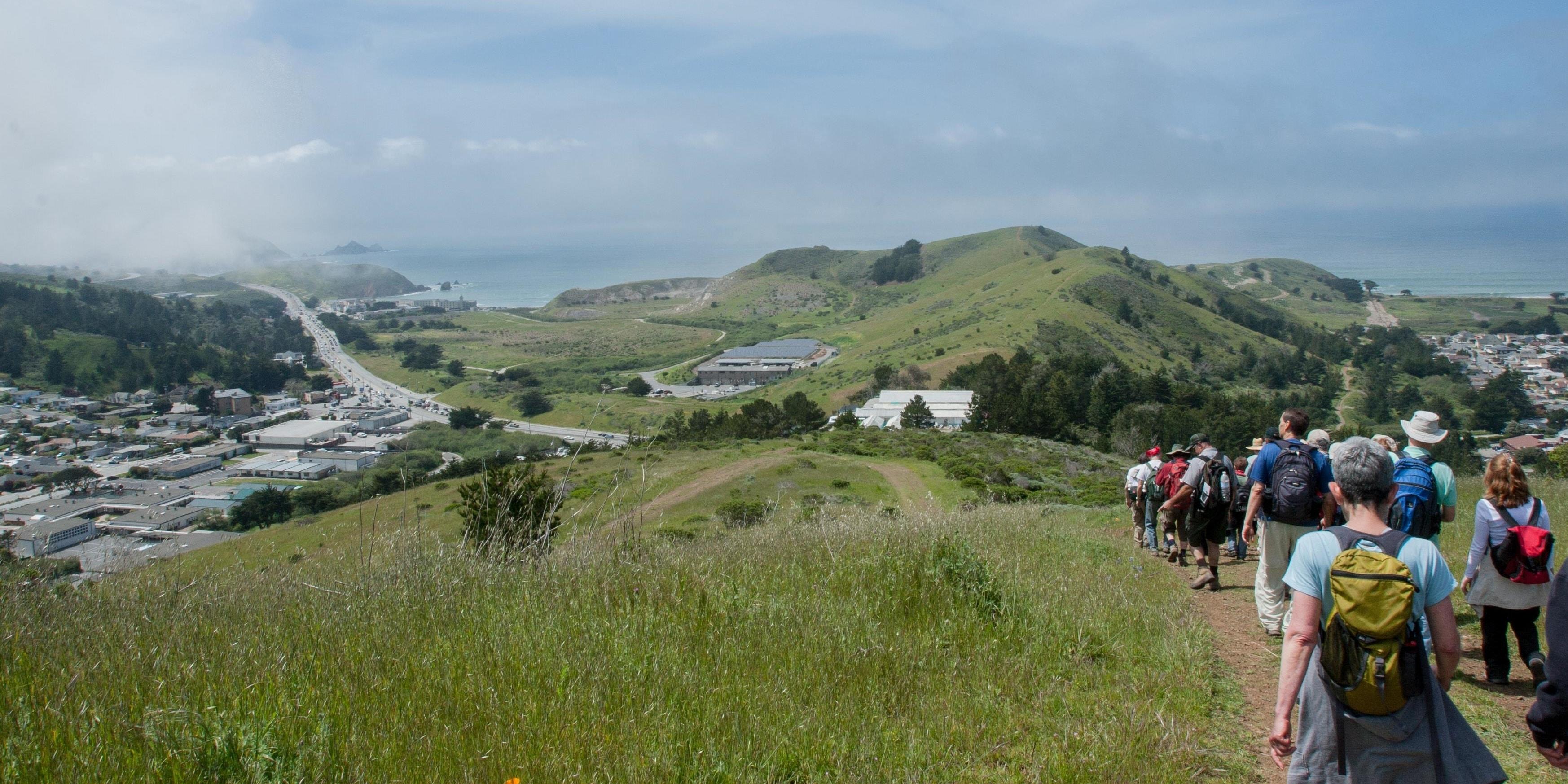 Hikers make their way down Sweeney Ridge