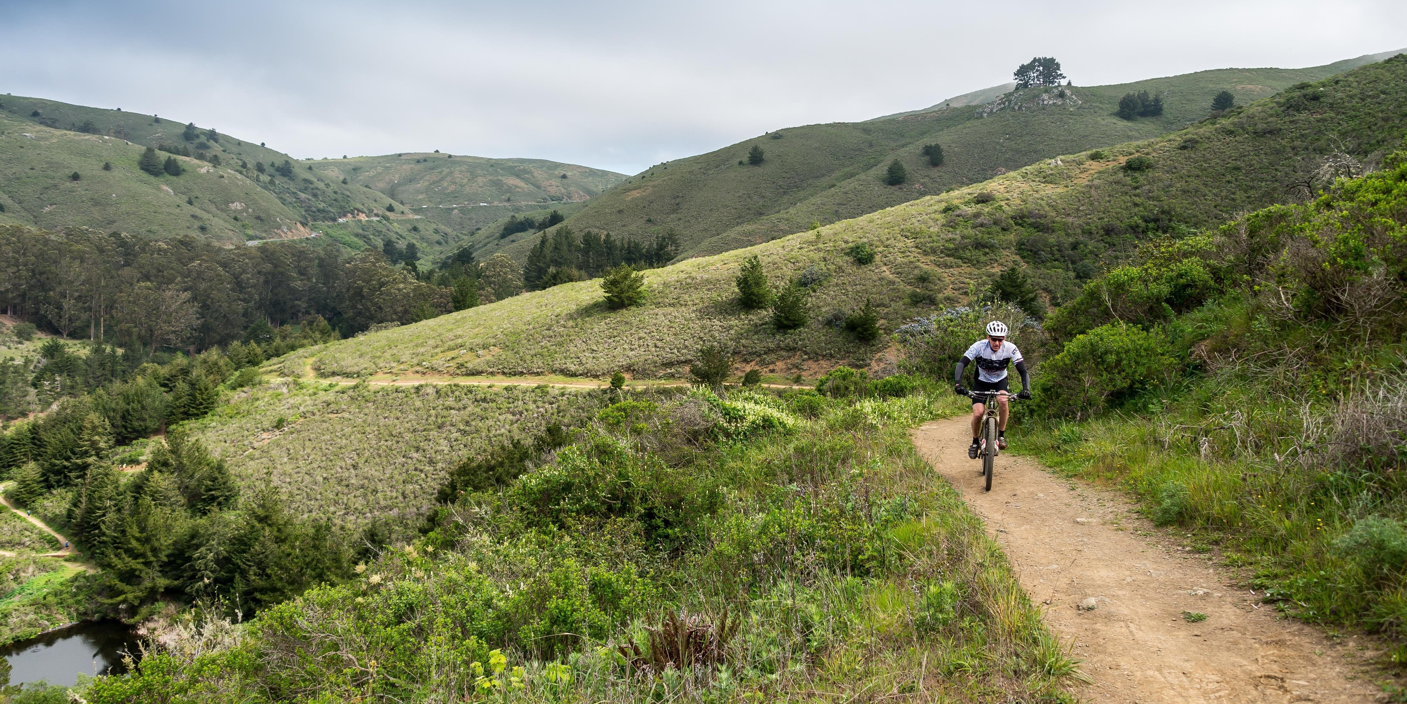 Cyclist pedals above Muir Beach