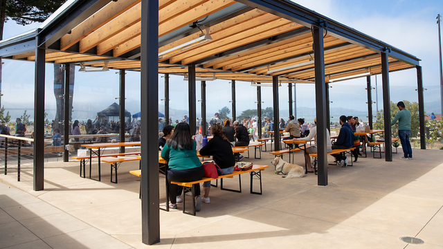 The Picnic Place at the Presidio of San Francisco Tunnel Tops. Visitors are sitting at picnic tables and enjoying a nice sunny day.