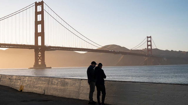 Park visitors in front of the Golden Gate Bridge.