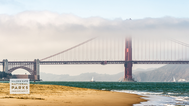A scenic view from Crissy Field East Beach of the famous san francisco fog engulfing the Golden Gate Bridge. Photo by Alison Taggart-Barone.